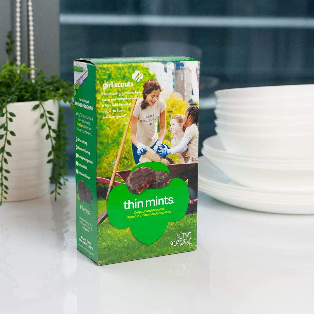 Girl Scouts Thin Mints in hand, a quick, delicious snack option.