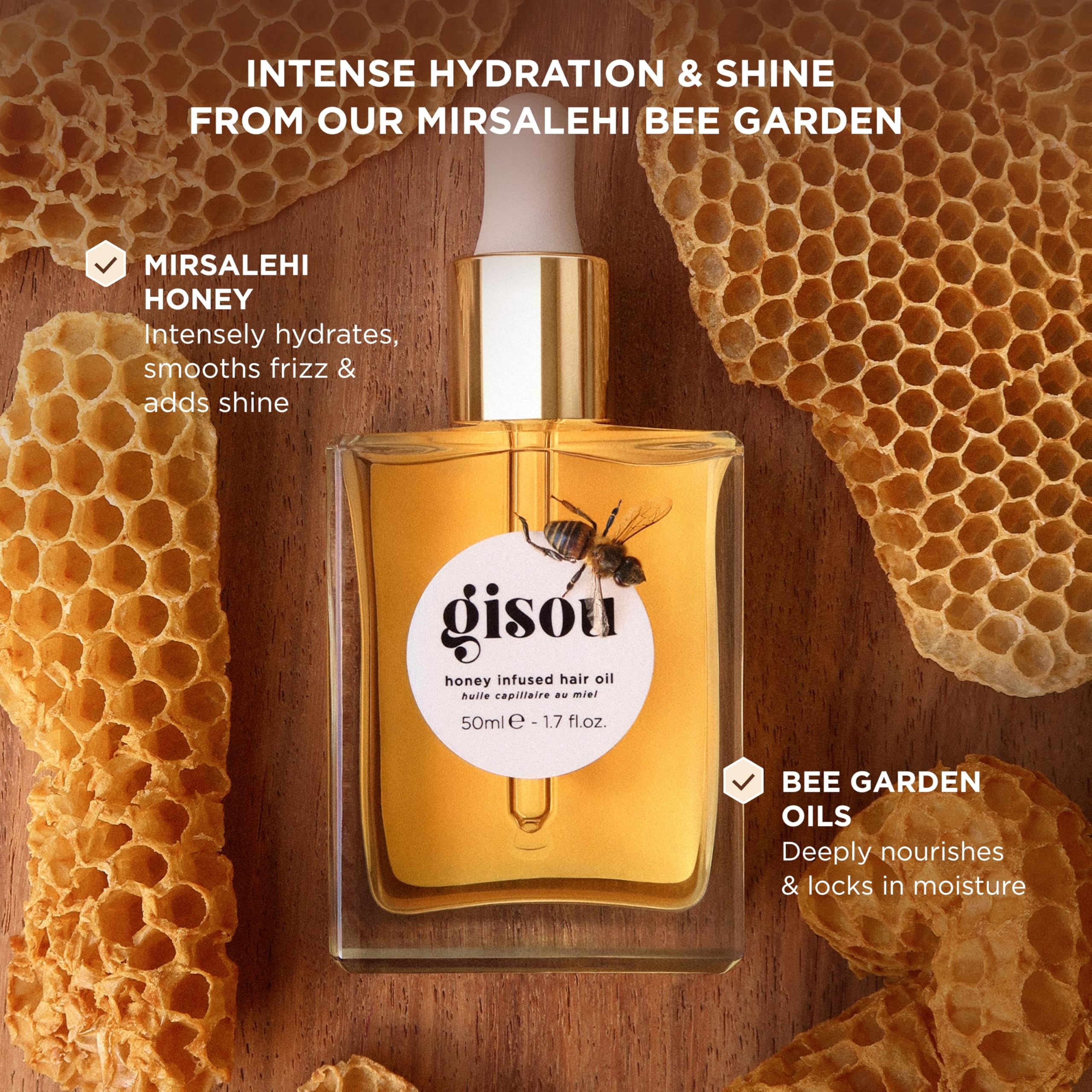Gisou Honey Infused Hair Oil mini bottle drop application close-up