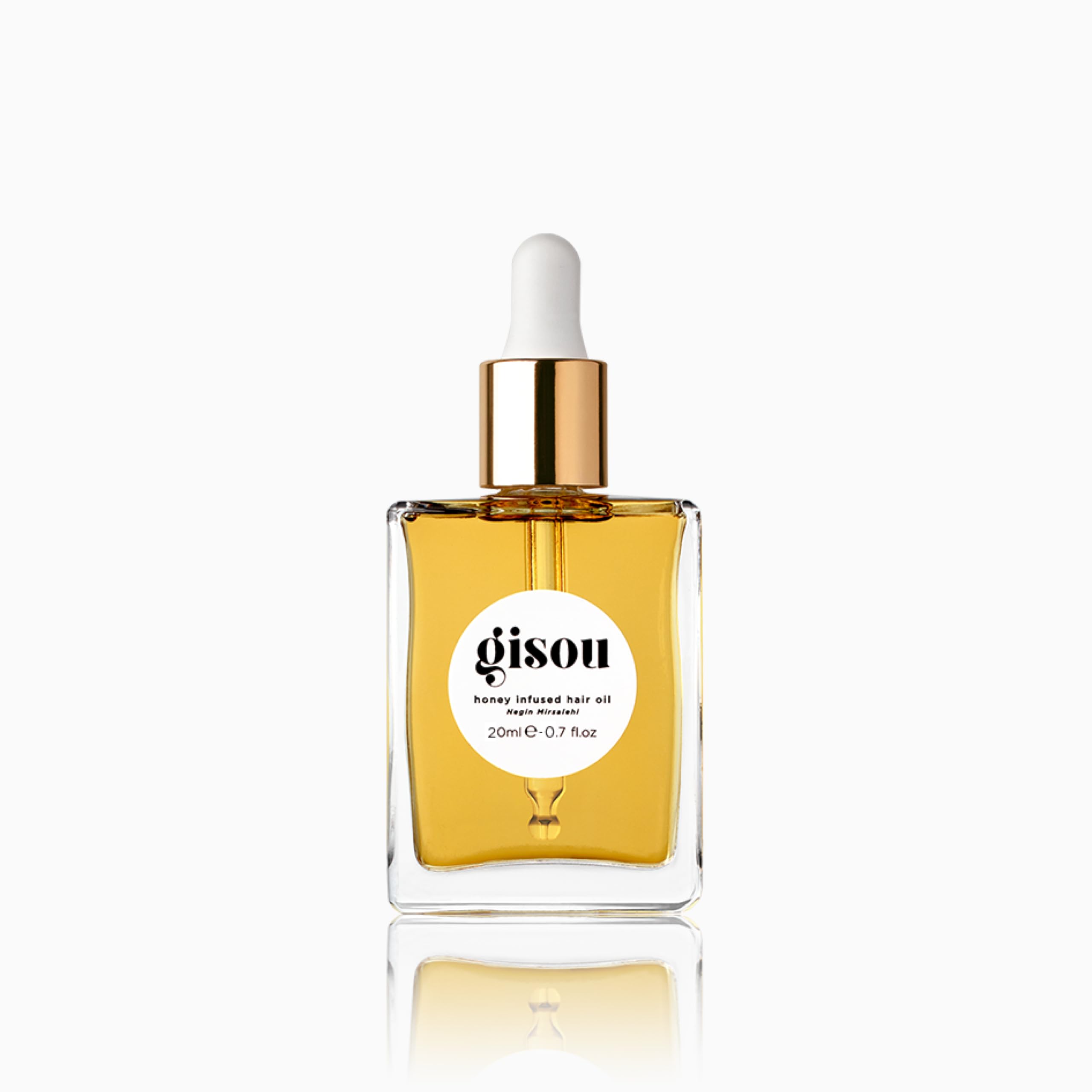 Gisou Honey Infused Hair Oil mini bottle prepared for travel and shine