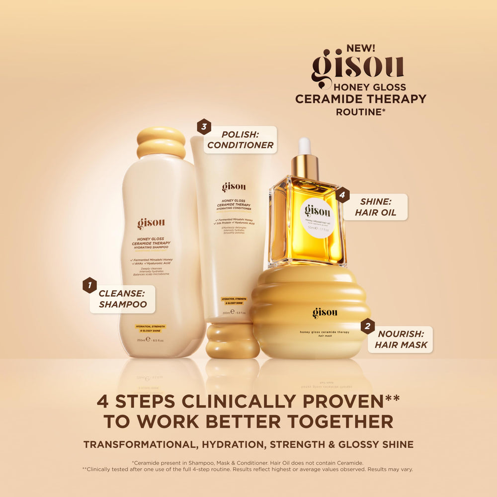 Gisou Honey Infused Hair Oil mini travel size on vanity