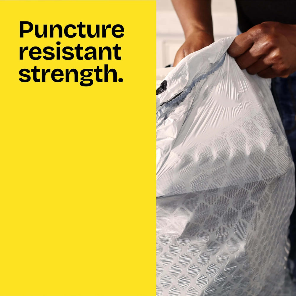 Glad ForceFlex 13-gallon bags demonstrate stretch around heavy loads.