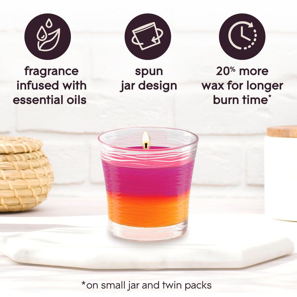 Glade candle lit ambience creating warm glow and fragrance.