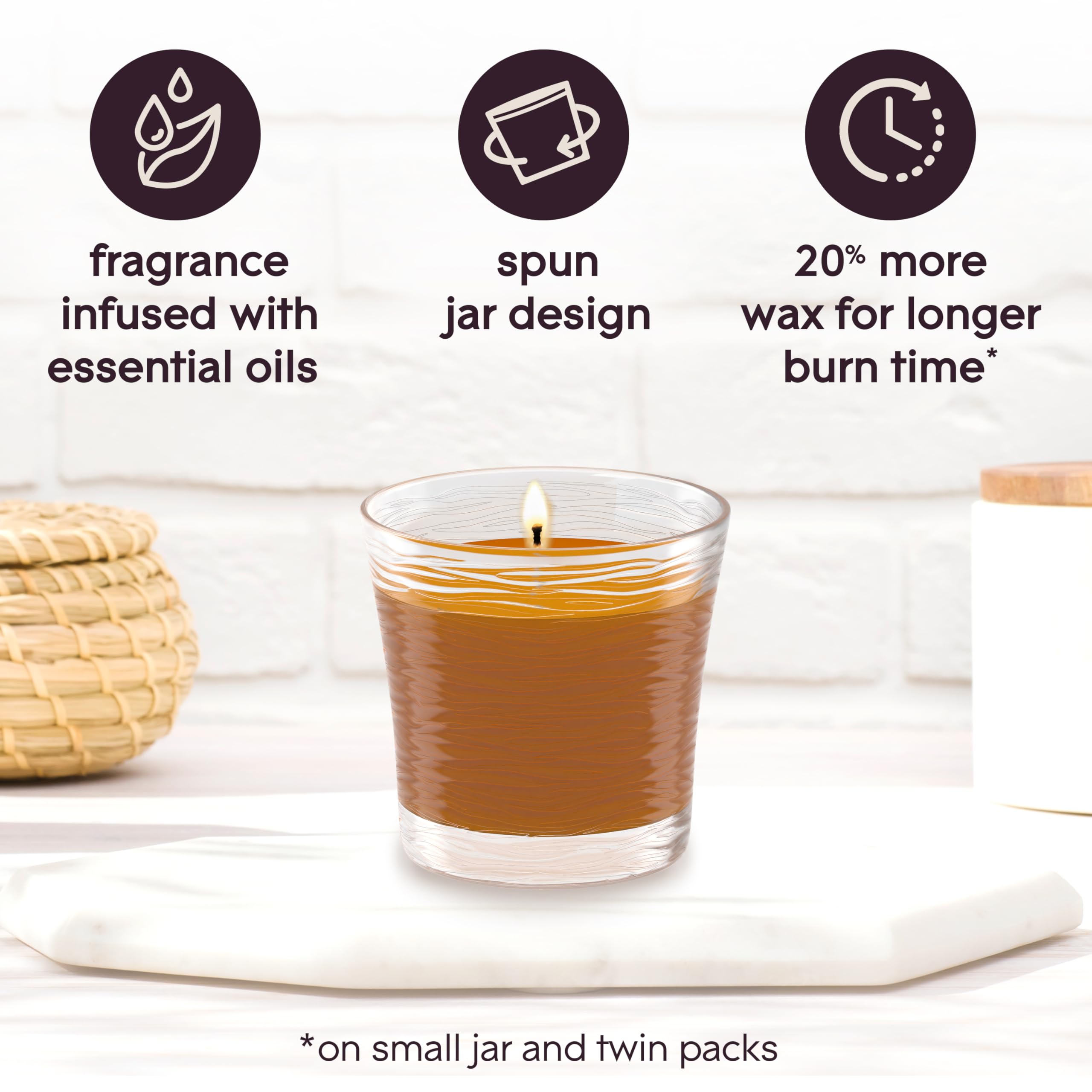 Glade Cashmere Woods candle jar packaging highlights essential oil infusion
