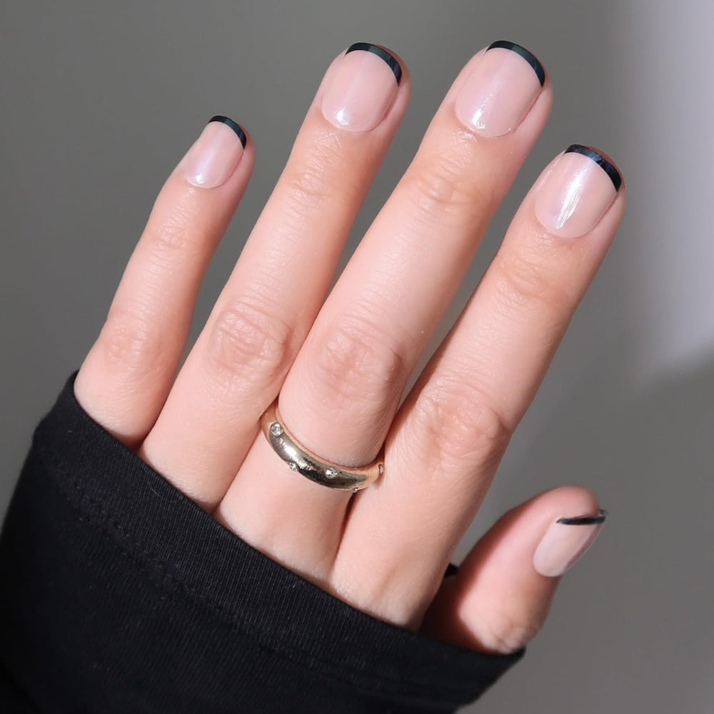 Glamnetic Burnt Miso nails with black French tips for a bold, salon-style look.