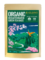 GLDNT Organic Decaf Green Tea Bags shown in a hot cup with smooth flavor.
