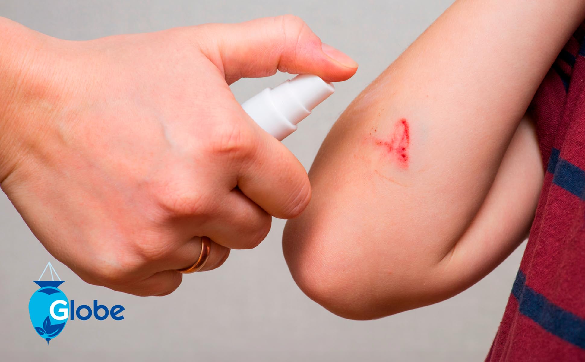 Globe antiseptic spray in a first aid kit for emergencies