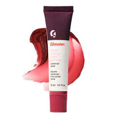 Glossier Balm Dotcom hydrates lips with berry burgundy tint for everyday wear.