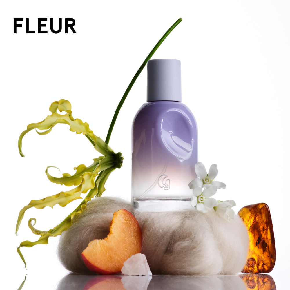 Glossier Doux bottle close-up, earthy woody vibe for relaxed days.