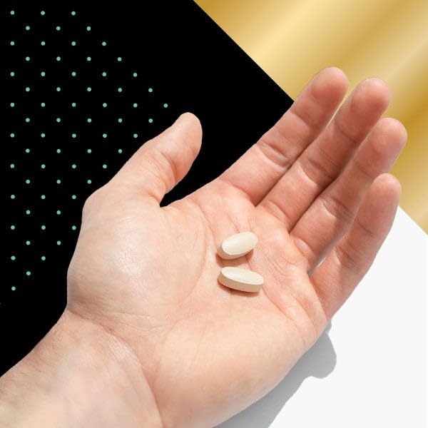 GNC Mega Men 50 Plus pill close-up reveals compact capsule shape.