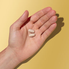 GNC Mega Men label info highlighting vitamin D-3 and minerals.