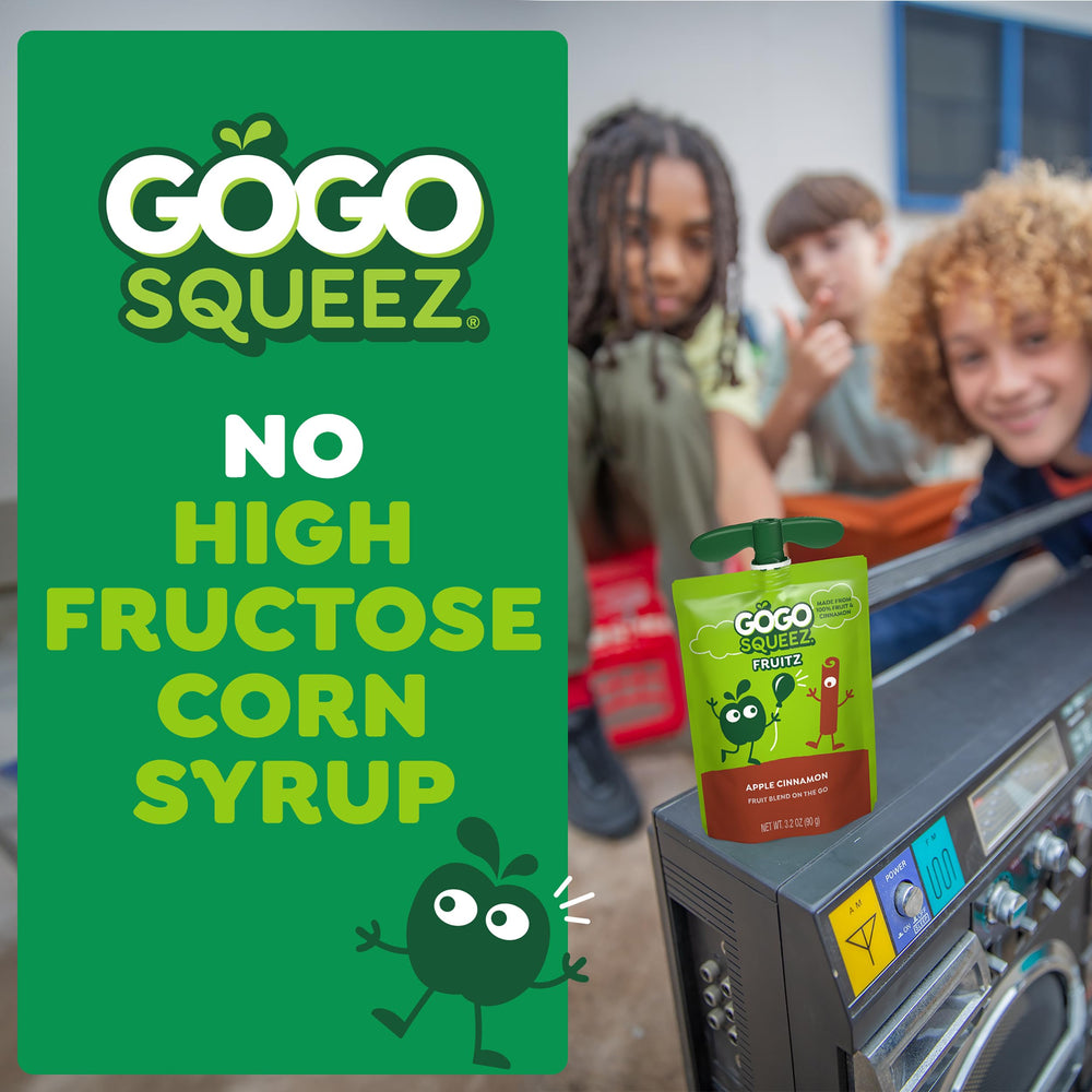 GoGo squeeZ pouch held in hand during a playful snack break.