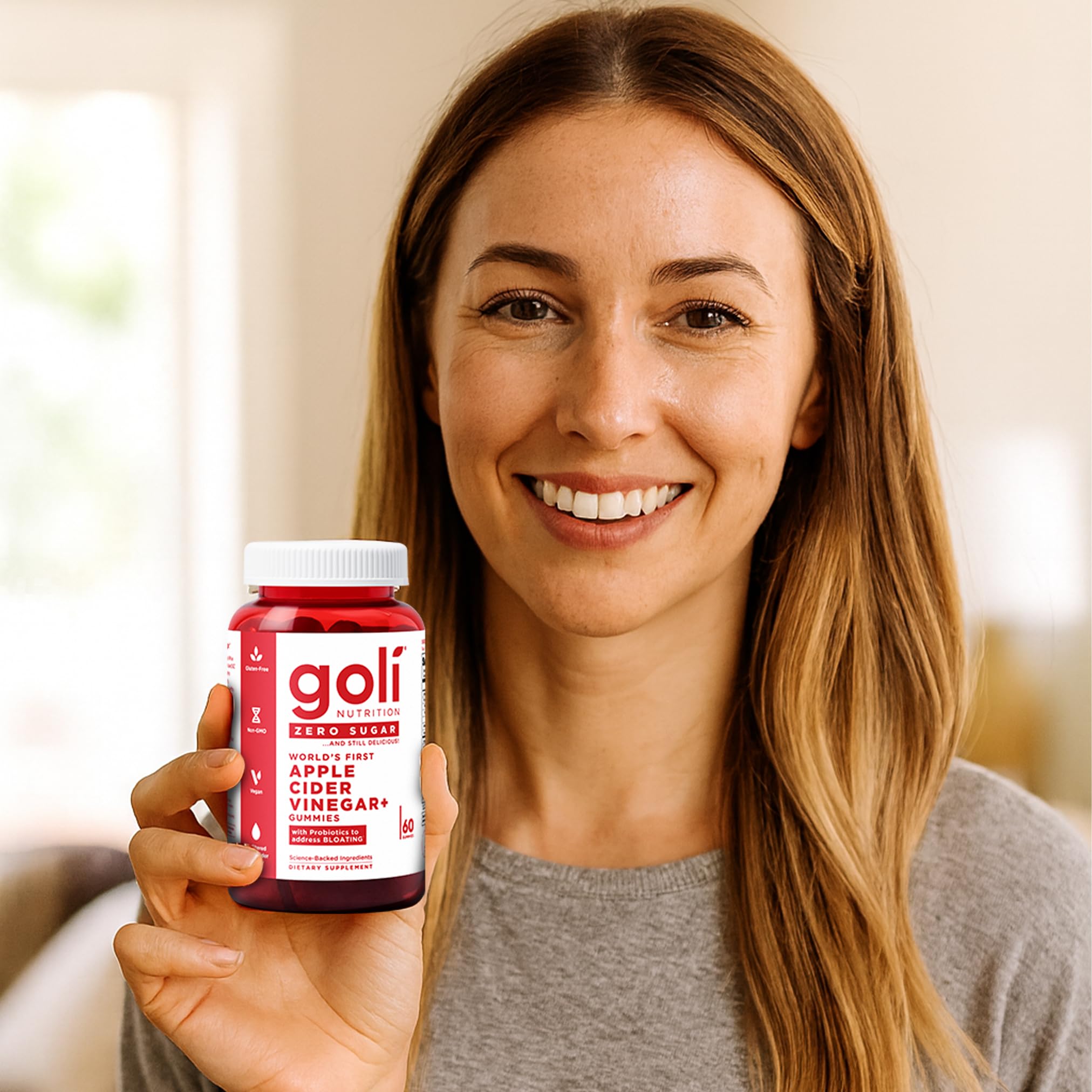 Goli Zero Sugar gummies next to a glass of water illustrate convenient daily use