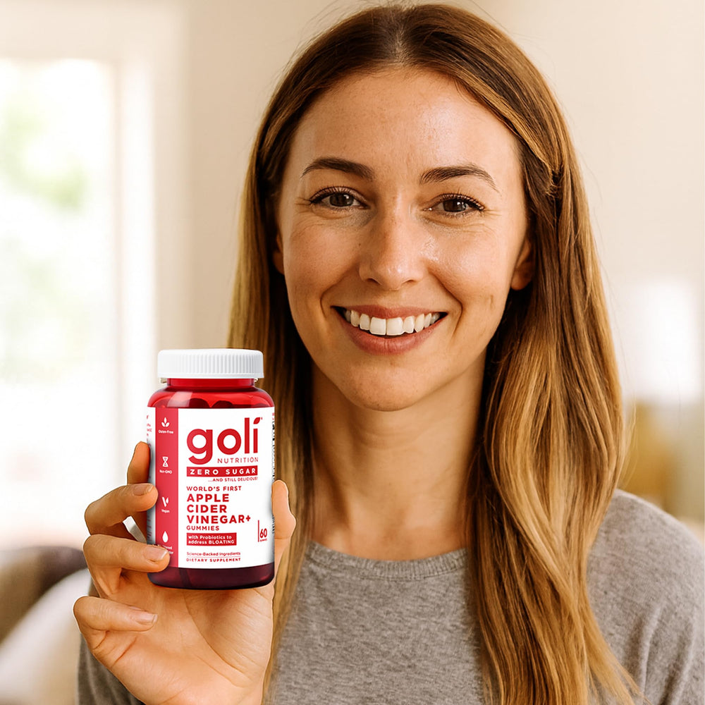 Goli Zero Sugar gummies next to a glass of water illustrate convenient daily use