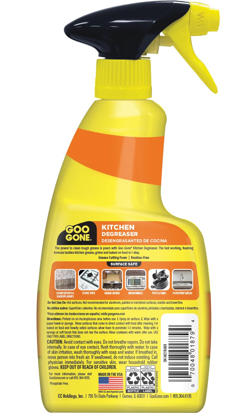 Goo Gone Degreaser applied to stove hood with foaming action