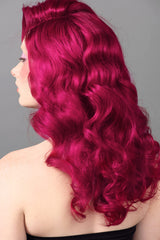 Good Dye Young magenta color swirl demonstrates fade-friendly staining on hair.