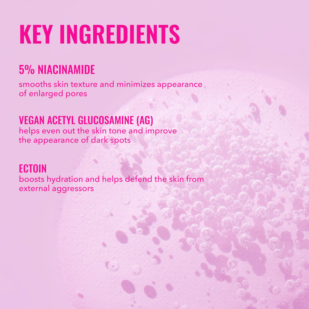 Good Molecules Niacinamide Serum with Ectoin texture swirl on surface.