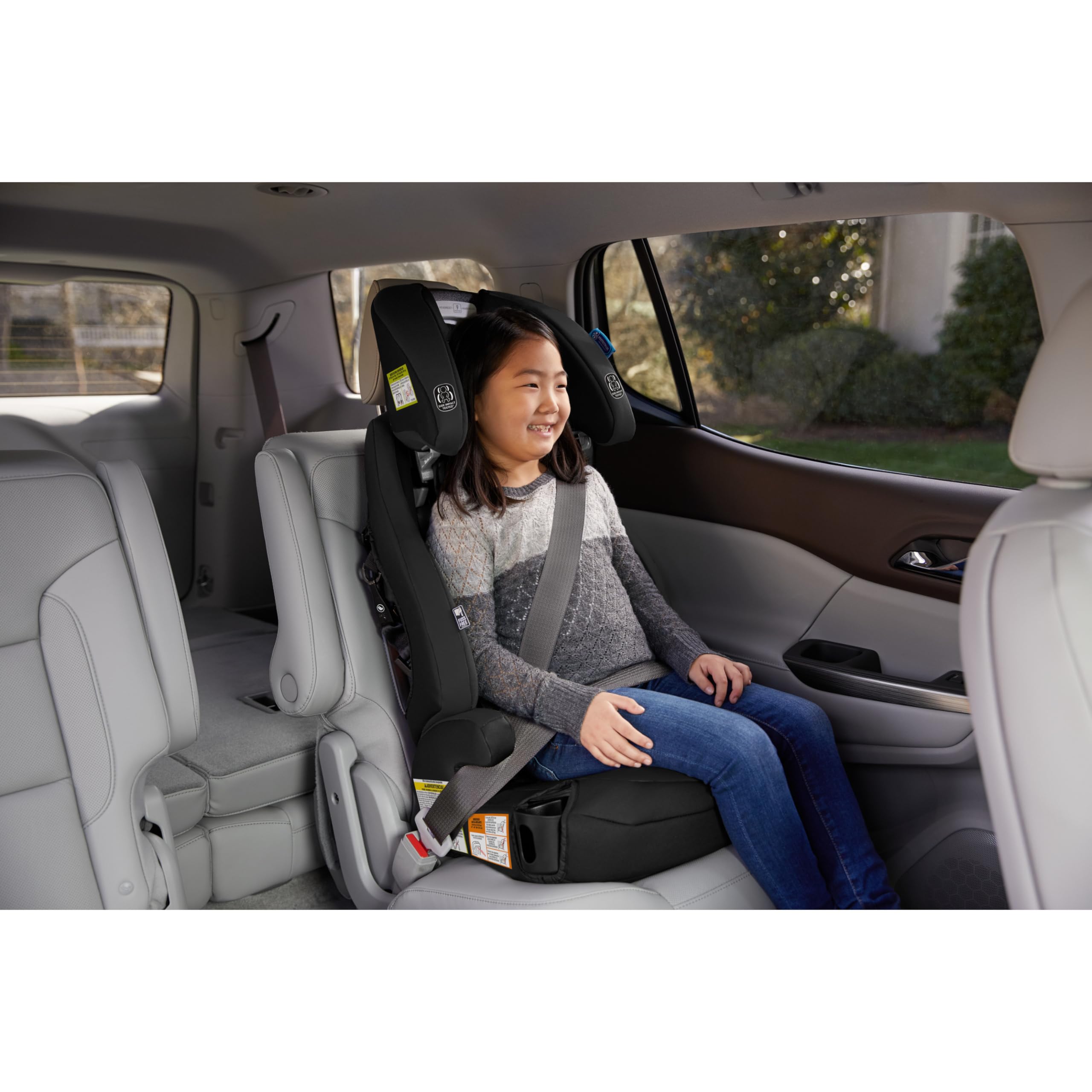 Graco Tranzitions cup holders pivoting to keep drinks accessible.