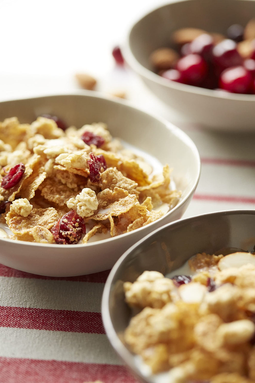 Great Grains Cranberry Almond Crunch cereal almonds and crunchy clusters on a spoon provide crunch.