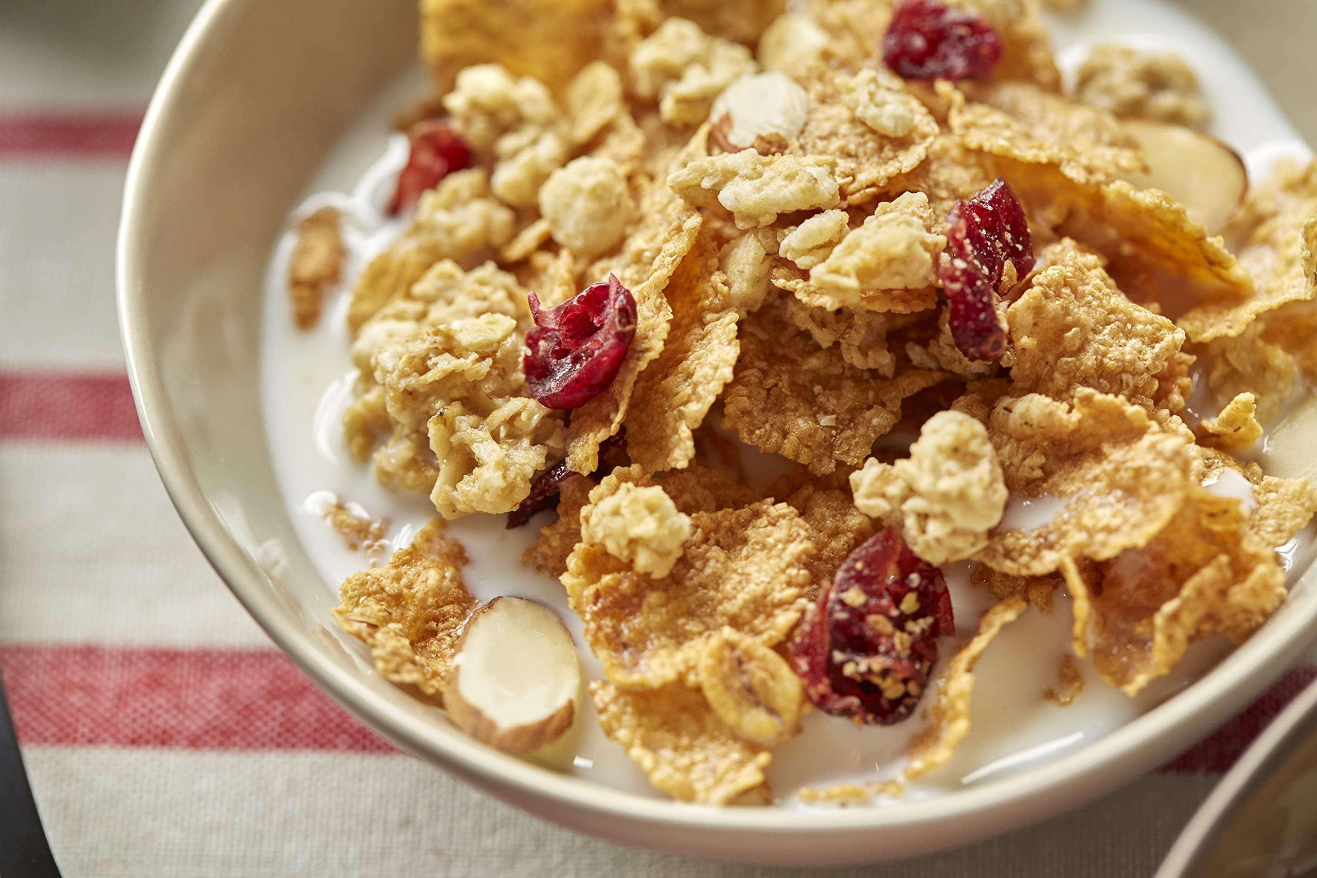 Great Grains Cranberry Almond Crunch cereal granola clusters brighten a breakfast bowl.