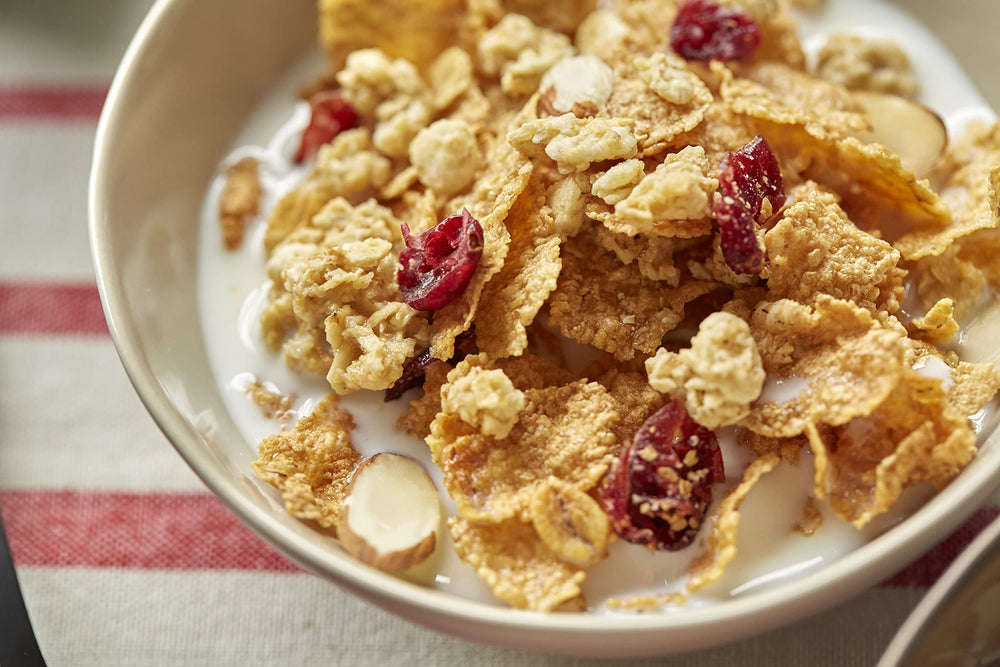 Great Grains Cranberry Almond Crunch cereal granola clusters brighten a breakfast bowl.