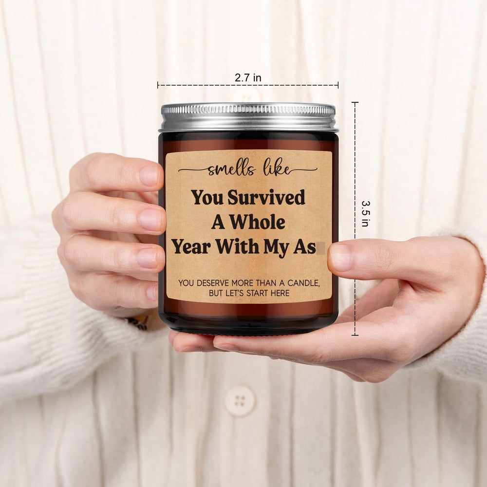 GSPY mood-setting candle on table hints at intimate gift ideas.