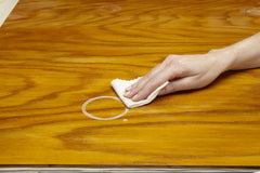Guardsman water ring remover cloth addressing minor blemishes and scratches.