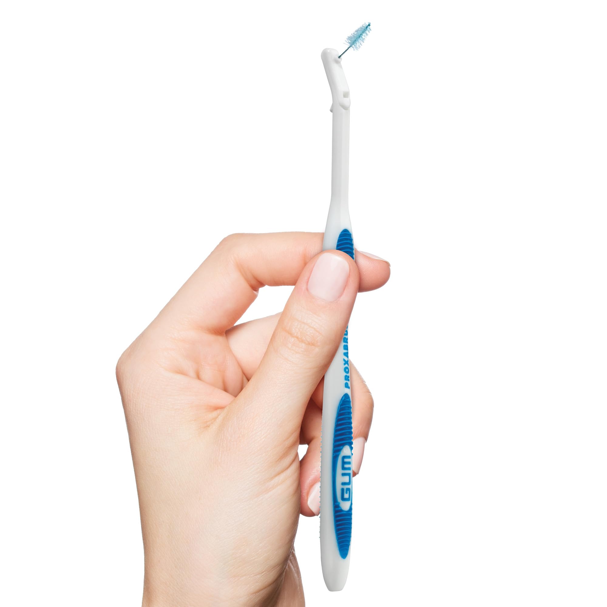 GUM Proxabrush handle in hand demonstrating stable cleaning control.
