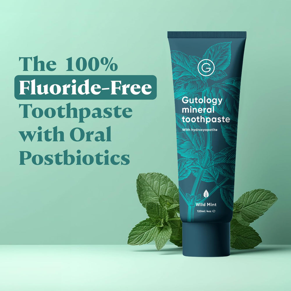 Gutology wild mint toothpaste tube close-up highlights refreshing flavor and fluoride-free formula.