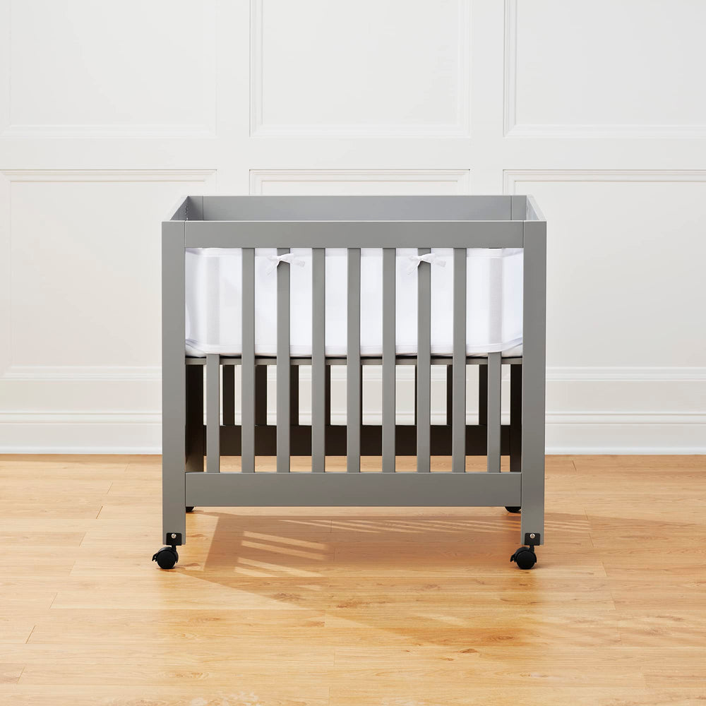 Halo mini crib liner fits 38x24 mattress with four-sided coverage