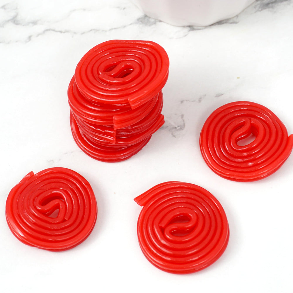 Party table featuring Broadway Strawberry Wheels licorice enhances treats.