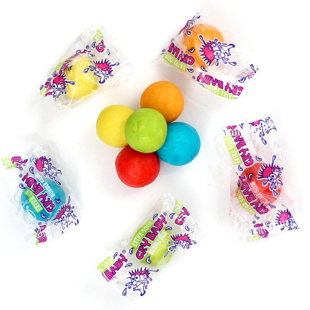 Party scene showing Cry Baby Extra Sour gumballs as party favors.