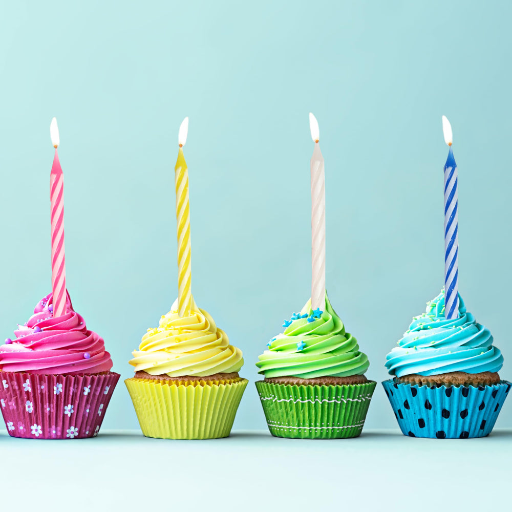 Hampton Distribution safe-burning spiral candles with holders for family celebrations.