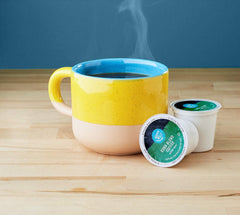 Happy Belly Kona Blend pods compatible with Keurig 1.0 and 2.0 for easy brewing.