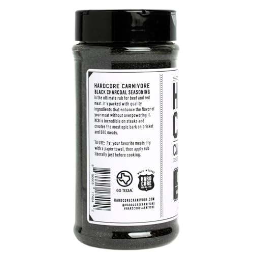 Hardcore Carnivore Black 13oz shaker held for easy seasoning during cookouts.