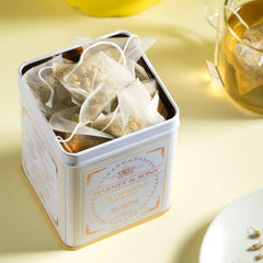 Harney & Sons chamomile sachet steeping in a cup with hot water.