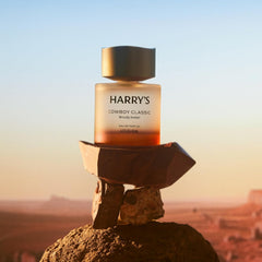 Harry's Cowboy Classic bottle among warm wood tones for masculine vibe
