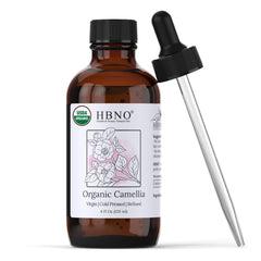HBNO Organic Camellia Oil bottle closeup showing premium, cold-pressed formula for skin and hair.