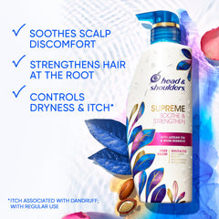 Drop of argan oil and rose essence on Head & Shoulders Supreme bottle, suggesting nourishment.