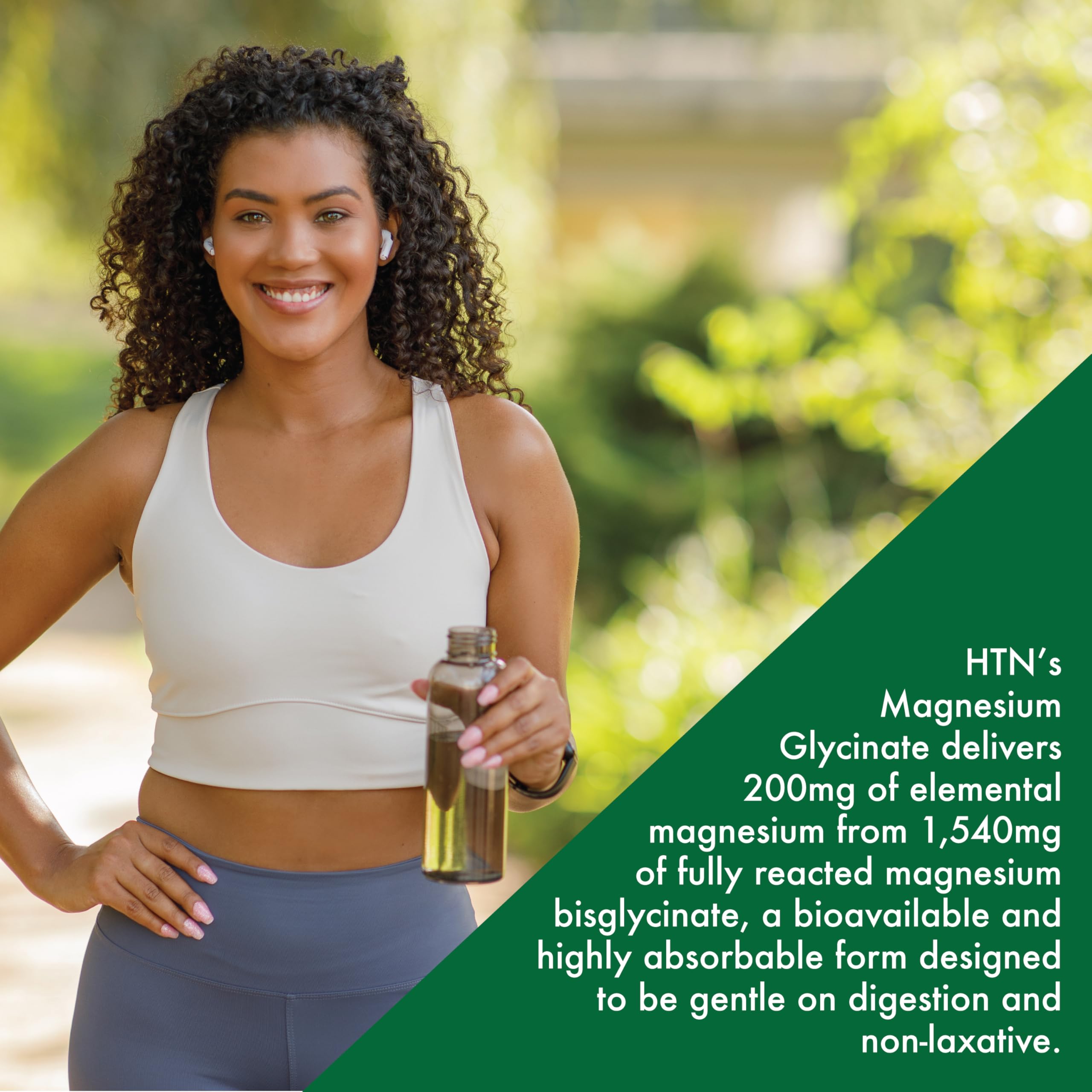 Health Thru Nutrition Magnesium Glycinate on kitchen counter with glass of water for easy supplementation.