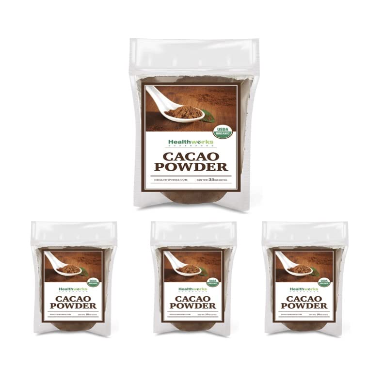 Healthworks Cacao Powder on wooden table close-up, highlighting fine texture.