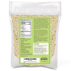 Healthworks hemp seeds being poured over a salad for texture.