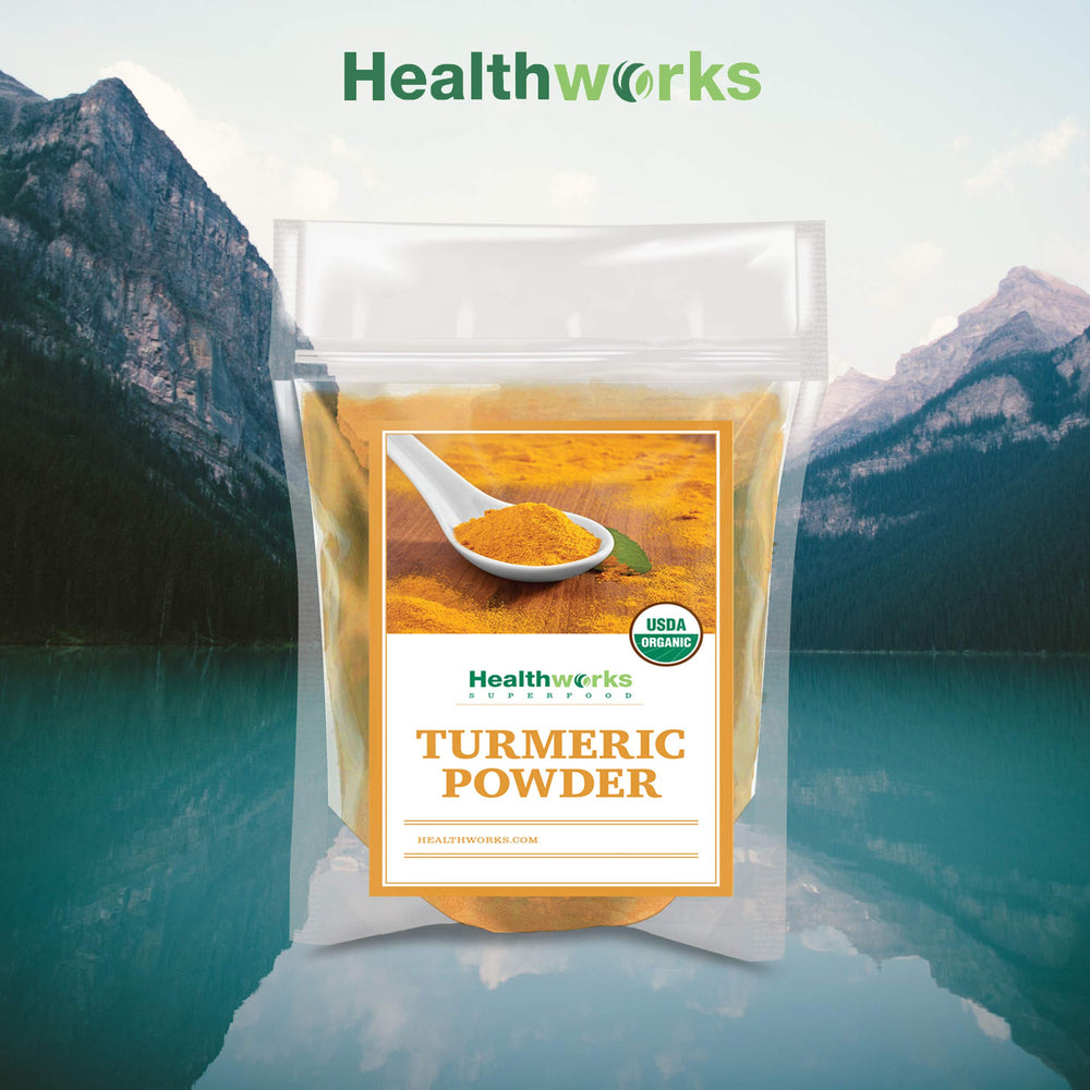 Healthworks Turmeric Powder mortar and pestle setup, traditional grinding for robust flavor.
