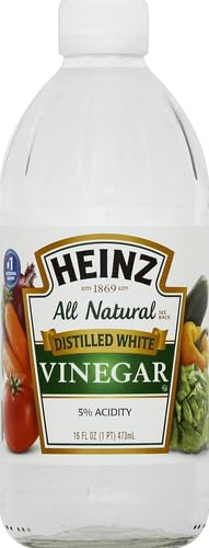 HEINZ white vinegar on a kitchen counter, ready for sauces and dressings.