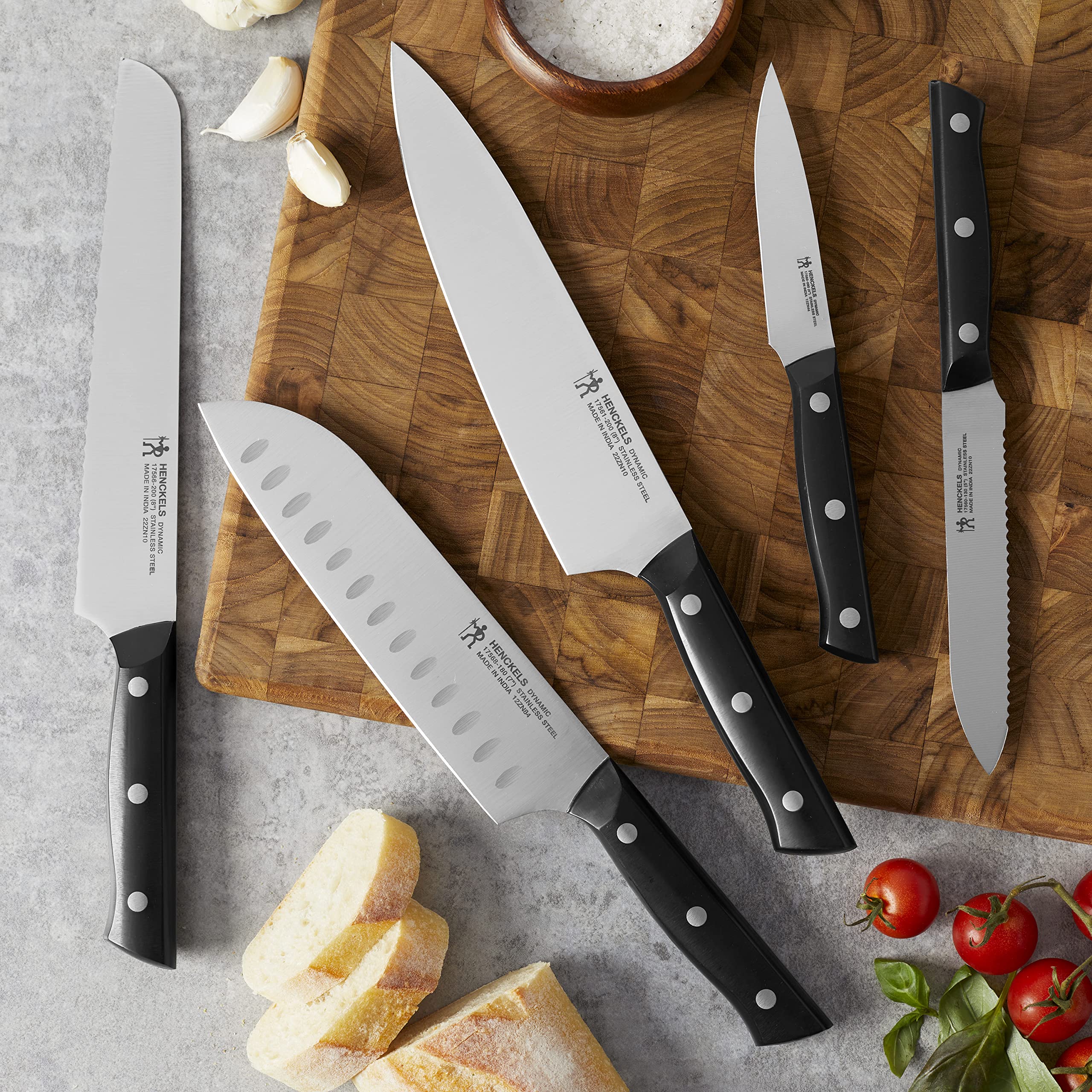 HENCKELS Dynamic 7-inch hollow-edge santoku knife for mincing and slicing versatility.