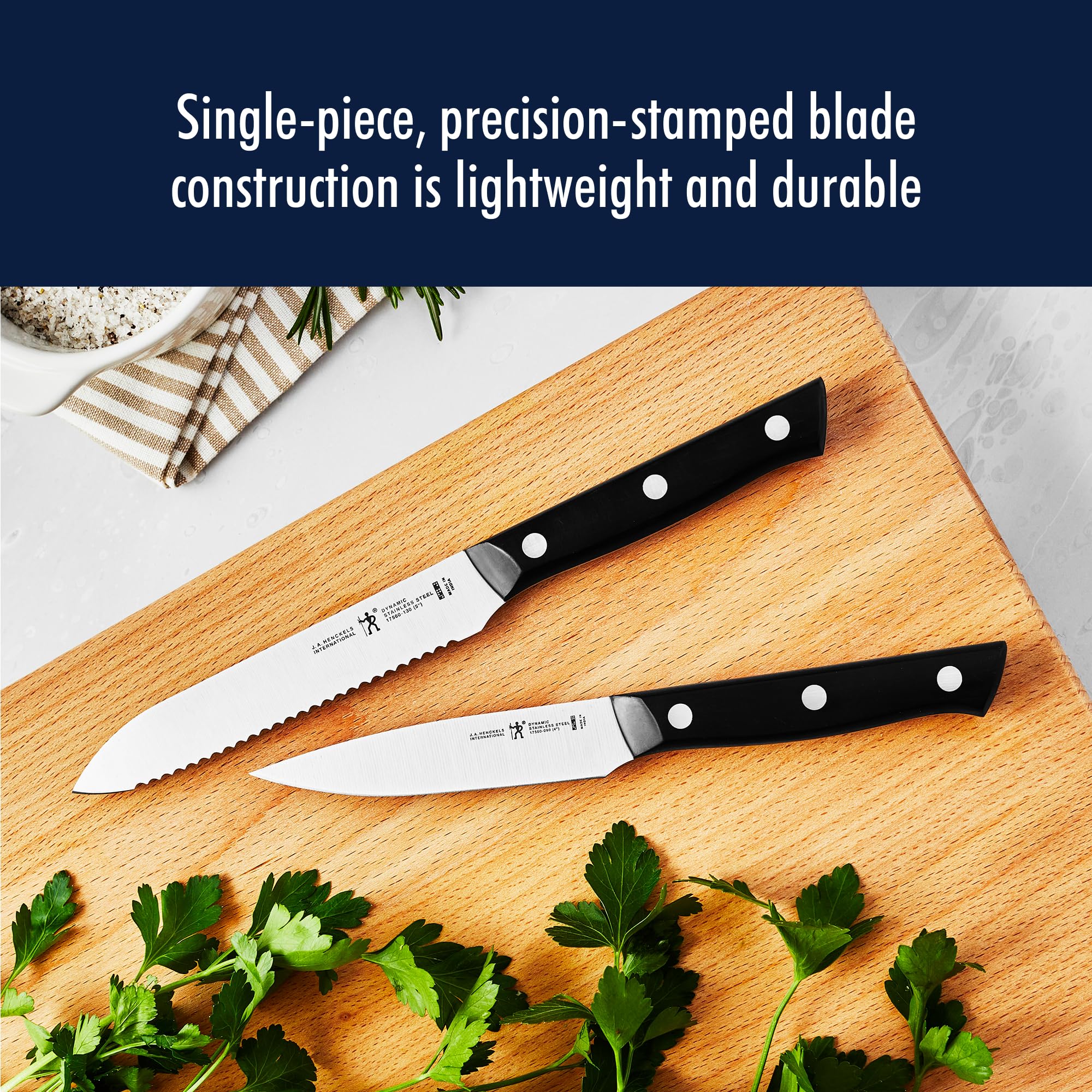 HENCKELS Dynamic ergonomic handle closeup demonstrates balanced, fatigue-free cutting.