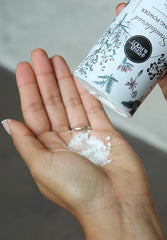 Herb & Root Sandalwood dusting powder application image shows easy use after moisturizing.