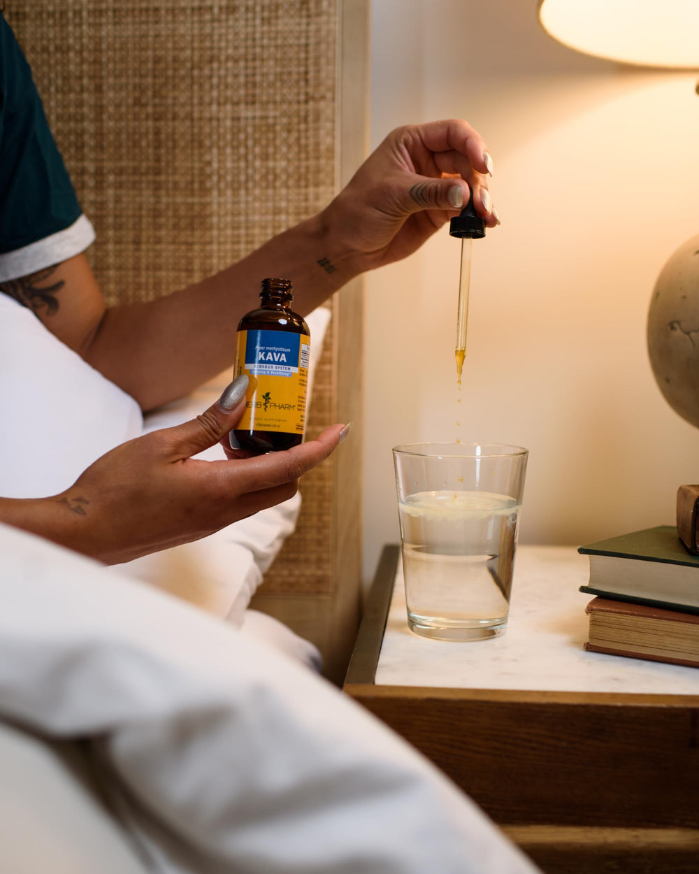 Pipette drawing kava liquid from Herb Pharm extract for easy dosing and relaxation.