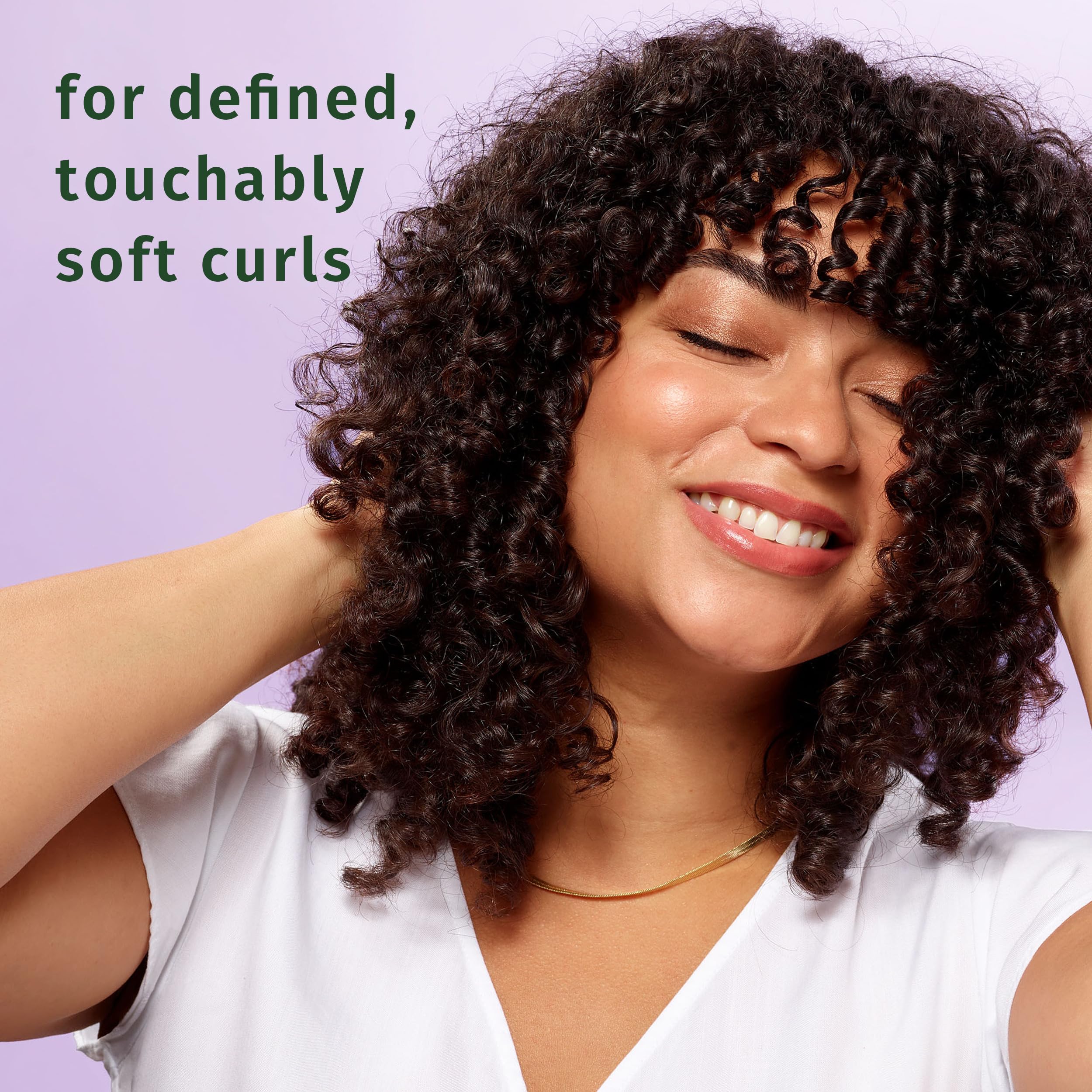 Herbal Essences Curl Boosting Mousse applied to wet hair