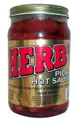 Herb's Pickled Hot Sausage jar ready to eat for outdoor snacking with bold, spicy flavor.