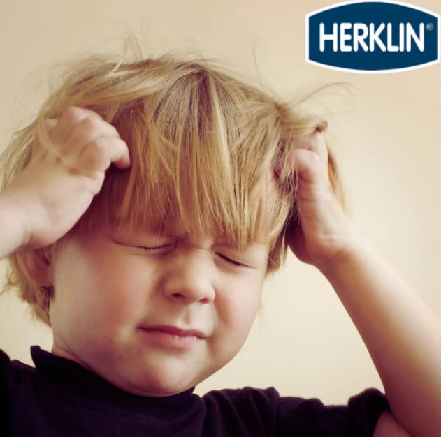 Rinsing away Herklin shampoo to reveal refreshed hair
